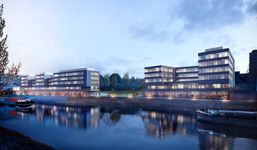 Neuss entwickelt 2023 – Hafenkante #1 Mehrere Gebäude im Abendlicht.